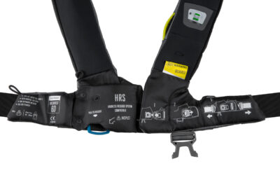 The Spinlock Harness Release System (HRS) is a new innovation which enables the wearer to disconnect from the safety line by releasing a lever behind the soft loop safety line attachment point of the lifejacket harness. Staying connected to the boat is undoubtedly safer than being in the water and use of a safety line is actively encouraged. However, in the event of a fall overboard, a casualty can find themselves being dragged/trapped alongside or behind the vessel. A situation which can be hard to be released from.